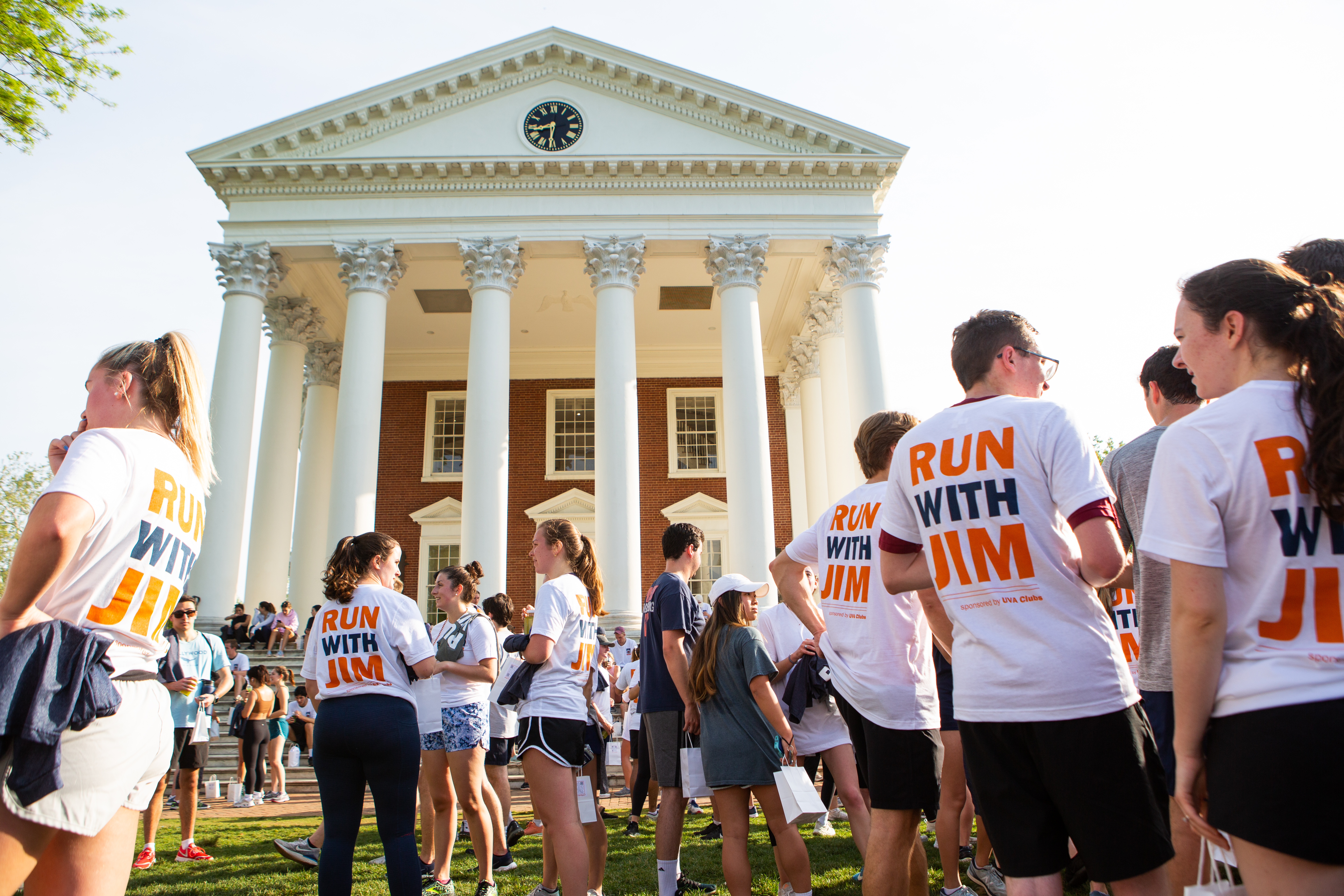 4TH Year students standing in front of the rotunda wearing "Run with Jim" shirts