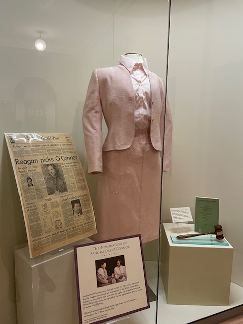Suit, gavel, and El Paso Herald-Post article displayed at the Supreme Court’s exhibit on Sandra Day O'Connor.