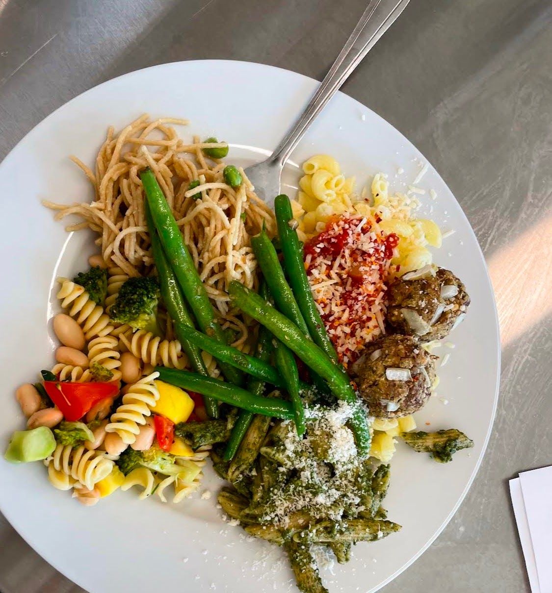 Plate of Food, Including Pasta, Cheese, and Green Beans